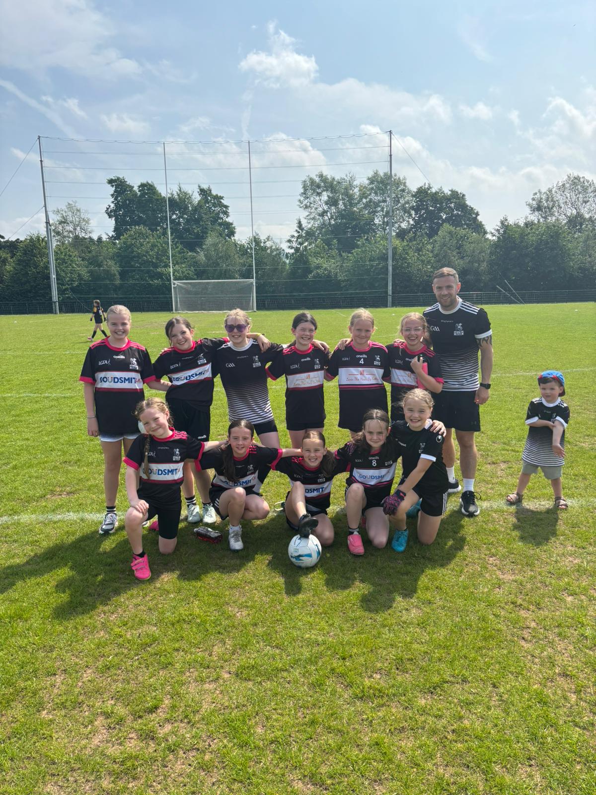 Gerard Haughey with the St Agnes girls’ team