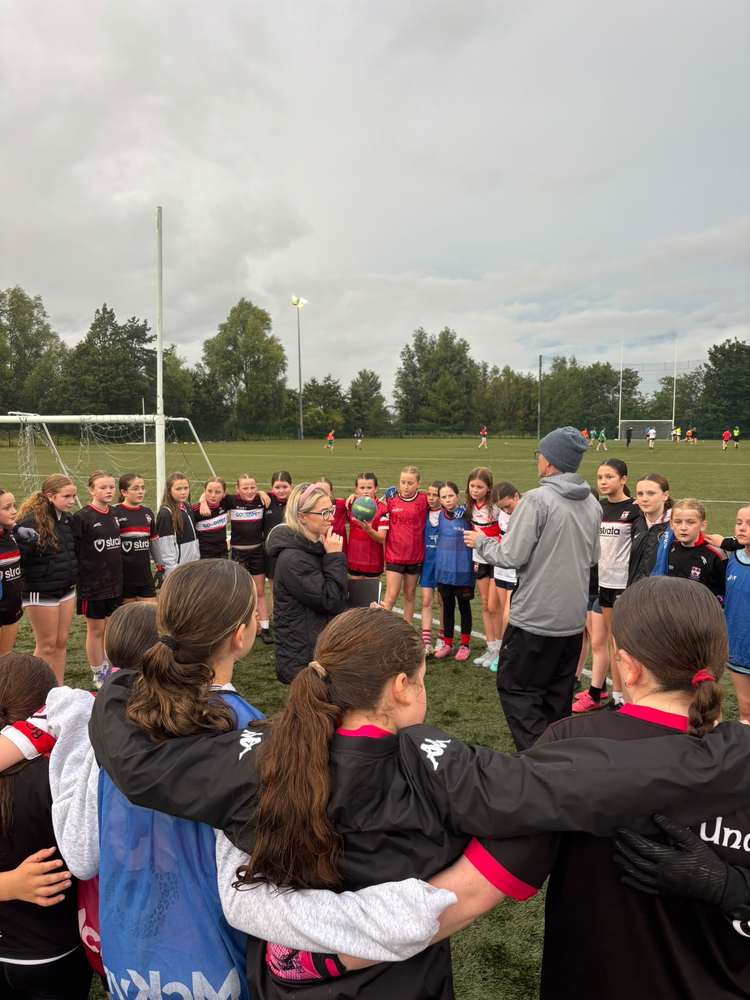 The girls listening during the training session