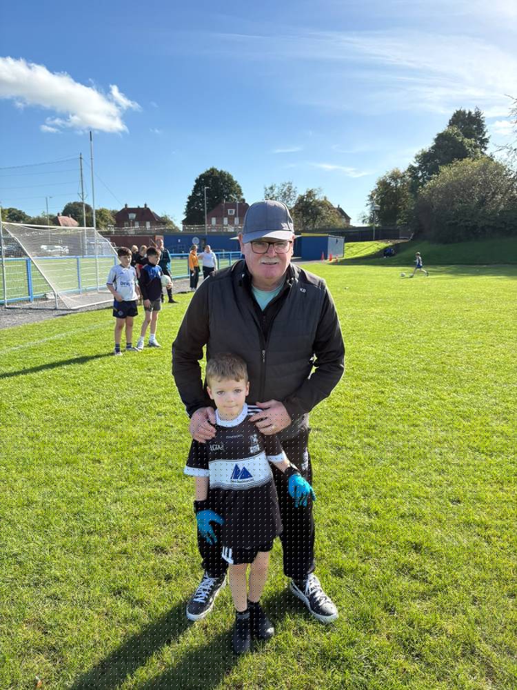 Kevin Burke pictured with Thomas after the U8 Go Games
